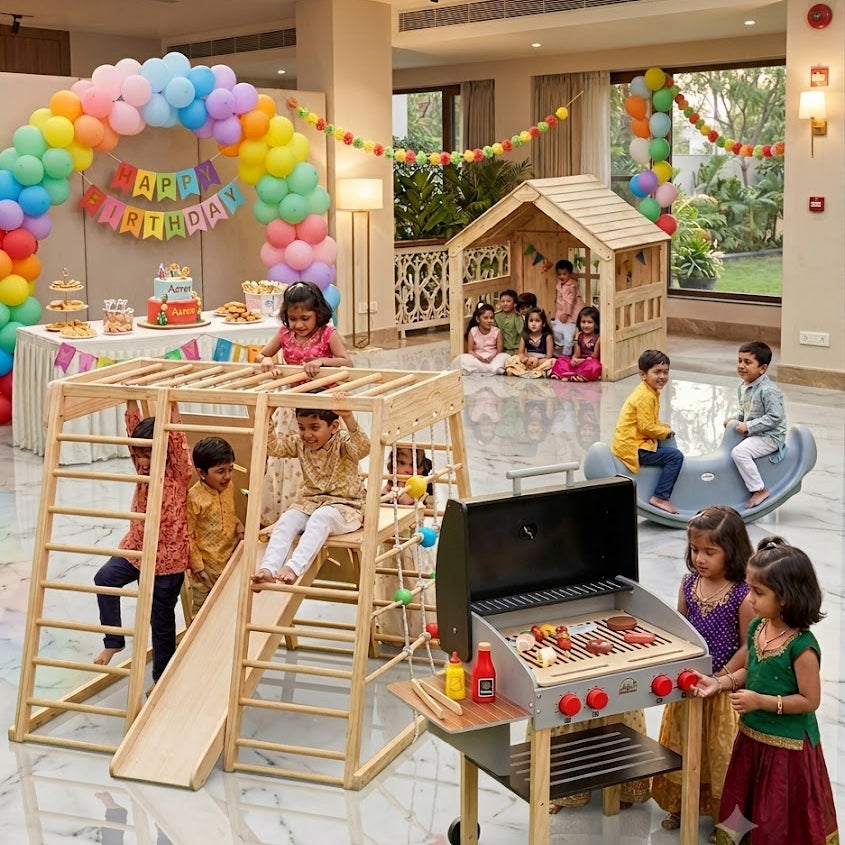 Children playing in a decorated indoor play area with a birthday theme.