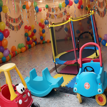 Children's play area with colorful toy cars and playground equipment.