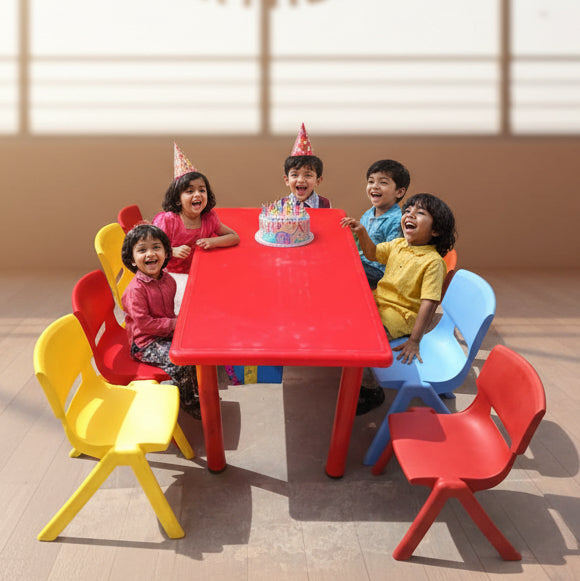 Colorful children's table and chairs set on a concrete surface.